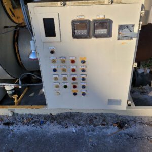 Industrial control panel with various switches.