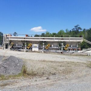 Mobile aggregate hopper with yellow chutes