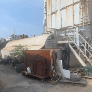 Industrial storage tank on construction site.