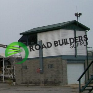 Building with "Road Builders Supply" sign.