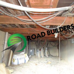 Crawl space with cables and insulation materials.