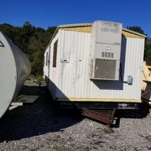 Trailer with air conditioner outdoors.