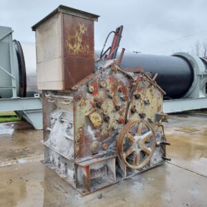 Rusty industrial machine with gears and levers.