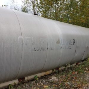 Large metal tank in outdoor setting.