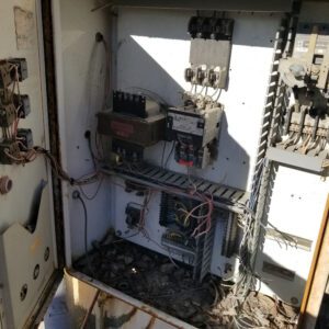 Open electrical panel with exposed wiring.