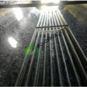 Metal pipes in a dimly lit tunnel.