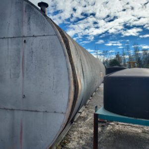 Large industrial tank under a cloudy sky.
