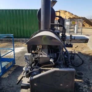 Industrial machinery outdoors on a sunny day.