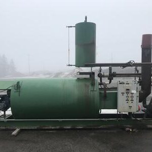 Industrial equipment on a foggy day outdoors.