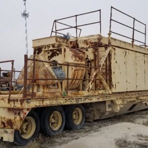 Rusty industrial trailer in an outdoor setting.