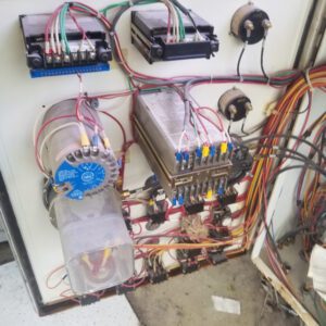 Electrical control panel with wires and components.