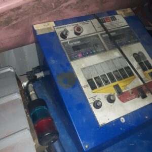 Industrial control panel with colorful switches.