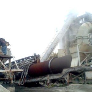 Industrial machinery with pipes and conveyor belts.