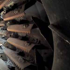 Rusty gears inside an industrial machine.
