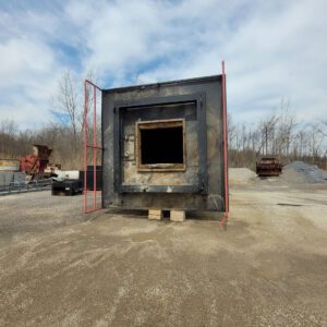 Industrial furnace in outdoor setting.