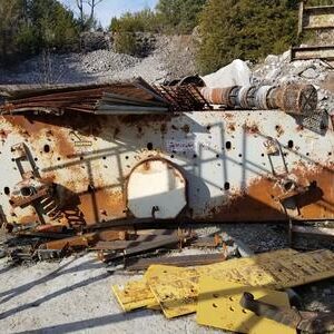 Rusty metal debris in outdoor scrapyard.