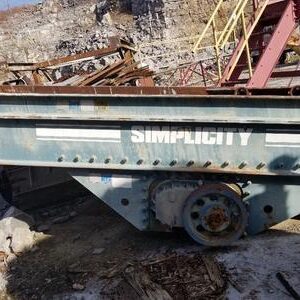 Industrial equipment labeled "Simplicity" in quarry setting.