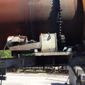 Large industrial gear mechanism with rusted components.
