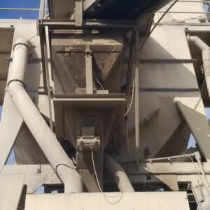 Industrial machinery with metal pipes and structures.