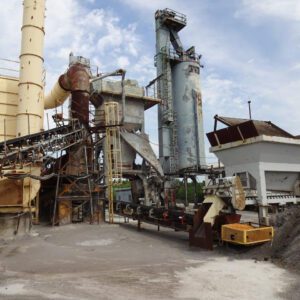 Industrial machinery with conveyor belts and towers.