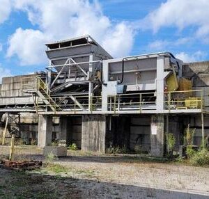Industrial equipment structure under a blue sky.