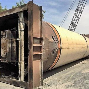 Large cylindrical object lying on construction site.
