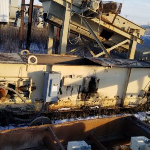 Industrial machinery in a snowy outdoor setting.