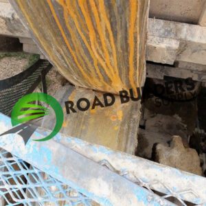 Construction machinery with "Road Builders" logo.
