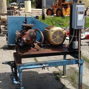 Industrial equipment on outdoor metal platform.