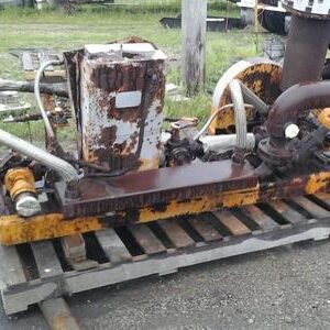 Rusty industrial equipment on wooden pallet.