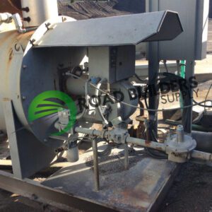 Industrial equipment with pipes and valves outdoors.