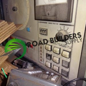 Control panel with cardboard sheets and tools.