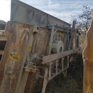 Rust-streaked concrete screed with attached motor