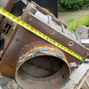 Rusty metal structure with measuring tape.