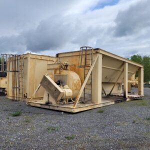 Beige hopper units and ladder on gravel