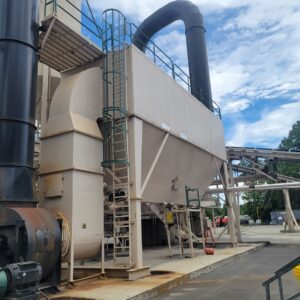 Industrial machinery with large pipes outdoors.