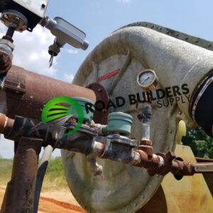 Close-up of valves and gauge on pump