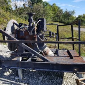Worn industrial pump mounted on skid