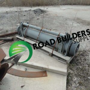 Construction equipment cylinder on wooden pallet.