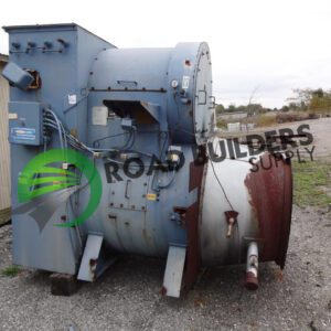 Industrial equipment on gravel near building.