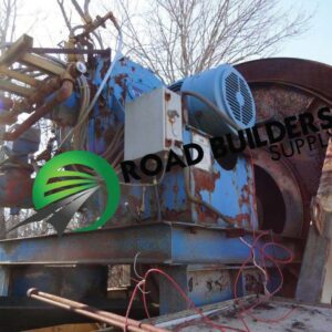 Rusty industrial machine with Road Builders logo.
