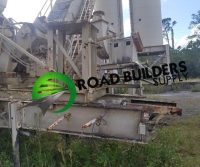 Road construction equipment in outdoor setting.