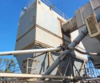 Industrial machinery structure under clear blue sky.