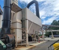 Industrial machinery with large pipes outdoors.