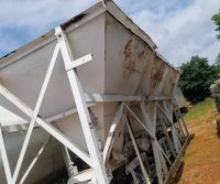 Large rusted industrial storage container outdoors.