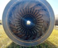 Inside view of large rusty turbine engine.