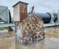 Rusty industrial machine with gears and levers.