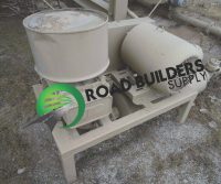 Industrial machinery with Road Builders Supply logo.