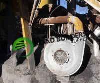 Industrial machinery with pipes and fan component.