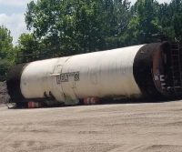 Large industrial tank on outdoor site.